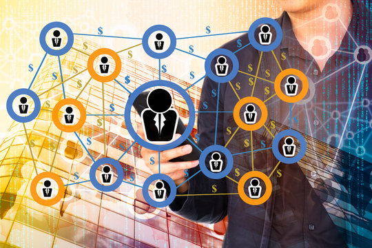 Fintech and Peer-to-peer payment concept.  Peer-to-peer payment network on double exposure of business man using smart phone and abstract office building background.