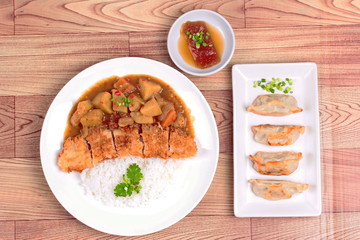 Jasmine rice with deep fried dolly fish in Japanese yellow curry and side dish of stuffing flour.