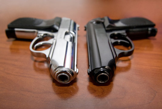 Two pistols on a table