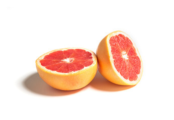 Sliced or cut grapefruit isolated on white