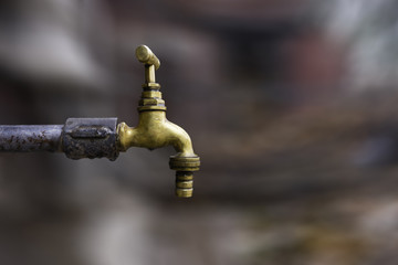 bronze tap isolated on the blurred background