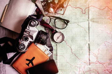 wanderlust and adventure concept, compass camera phone passport