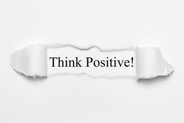 Fototapeta premium Think Positive! on white torn paper