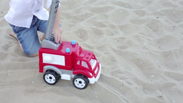 The Boy Played with a Machine on the Beach