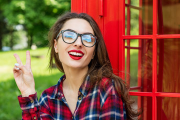 Beautiful young woman walking in the city. Europe, England. Vaca