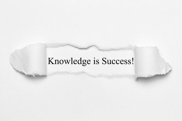 Knowledge is Success! on white torn paper