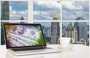 Digital disruption concept background. Laptop computer with digital code abstract on its screen against the city outside building background.