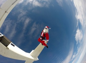 Santa Claus jumping from the plane