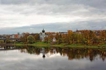 Fototapeta premium Old church on the river bank of Pskov, Russia. Orthodox temple in the ancient city.
