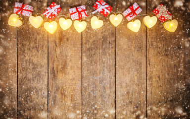 Christmas colored lights with decoration on wood