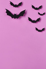 Halloween background. Papercut bats flying. Top view with copy space