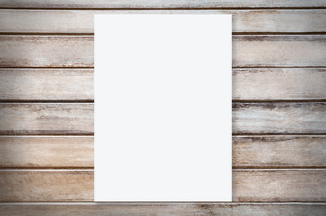 White paper mockup template on wood background.