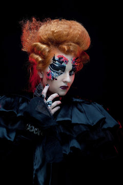Gothic redhair witch. Dark woman. Halloween picture.