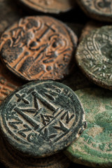 Ancient copper coins with letters and portraits of emperors