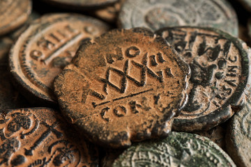 Pile of beautiful ancient copper coins with symbols