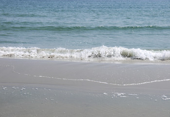 Wave of the sea on the sand beach