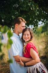 Fototapeta premium Romantic Beautiful young couple walking in autumn park