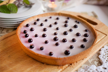 Homebaked Summer Berry Cheesecake with Jelly on the Top made from  currant, and adorned with mint