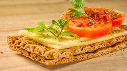 Sandwich with cheese and tomato on dry bread. Delicious.