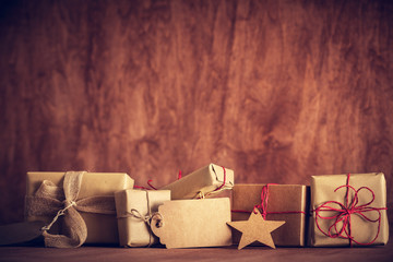 Obraz na płótnie Canvas Rustic retro gift, present boxes with tag. Christmas time, eco paper wrap.