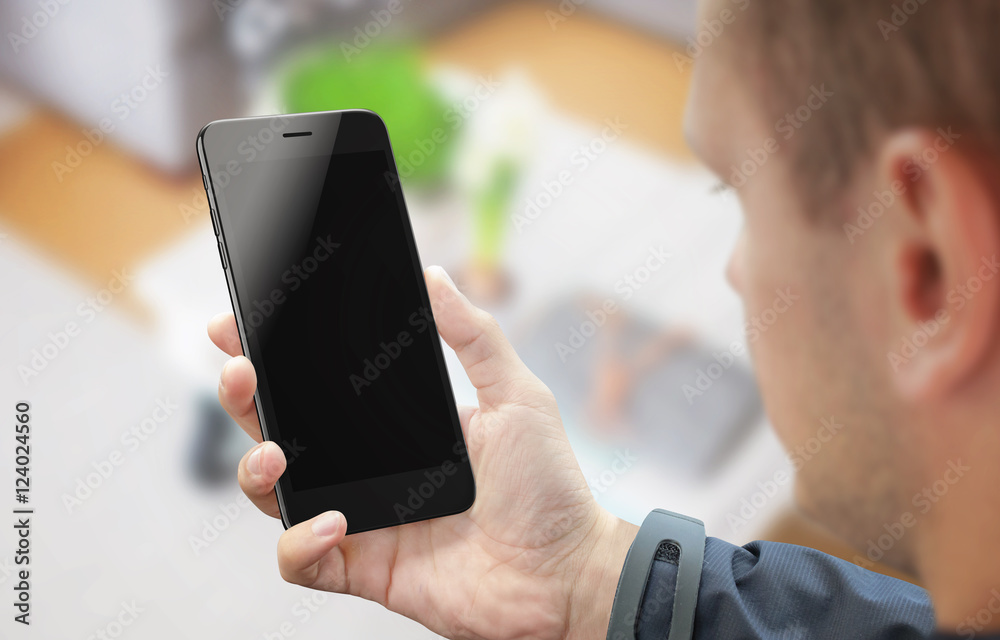 Aufkleber Man work on smart phone display. Isolated smart phone for mockup in hand. Blank screen of mobile device for app presentation.