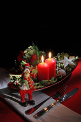 holiday rustic Christmas and New Year table setting with xmas decorations at dark wooden table. Selective focus