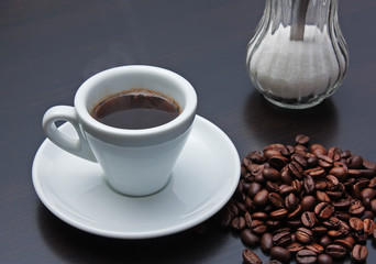 pile of coffee beans and a cup