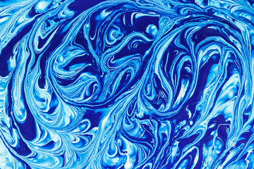 mixing paint blue white, abstract background