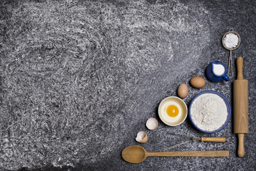 Ingredients cakes on a black background. Free space for your text.