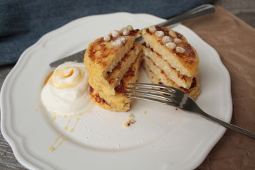 Russian sweet cheese pancakes with sour cream for Breakfast or a snack - it's delicious