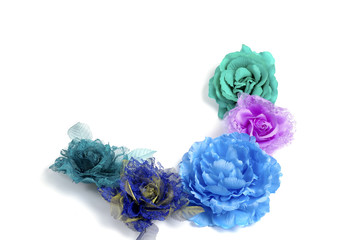 Floristics - blue artificial flowers on white background