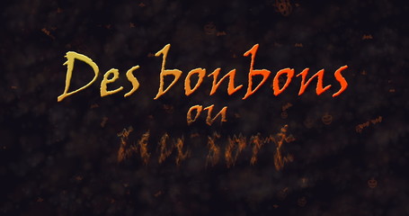 Des bonbons uo un sort (Trick or Treat) French text dissolving into dust from bottom.