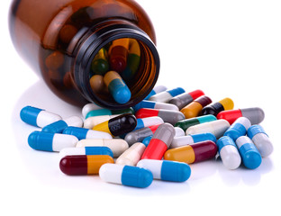 Heap of medicine pills isolated on white background.