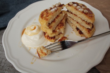 Russian sweet cheese pancakes with sour cream for Breakfast or a snack - it's delicious