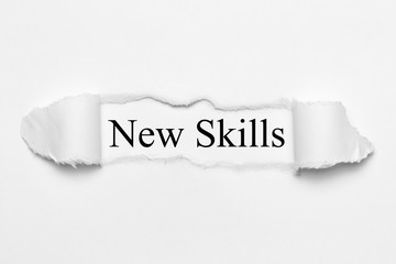 New Skills on white torn paper