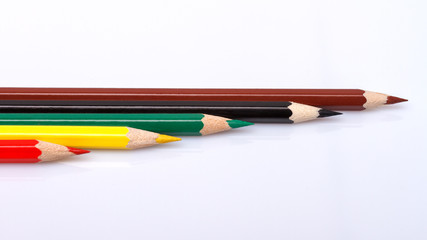 Colored pencils isolated over white background