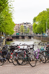 Fototapeta premium Bikes on the street in Amsterdam, Netherlands