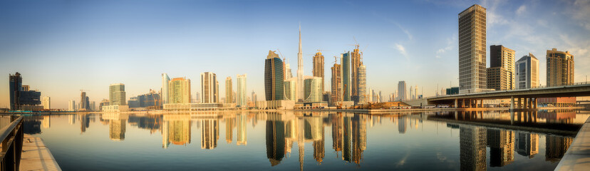 Obraz premium Panoramic view of Business bay and downtown area of Dubai at sunrise, UAE