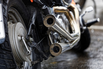 Fototapeta na wymiar Exhaust pipes and rear wheel of motocicle