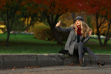 Pretty girl taking selfie in autumn park. Instagram