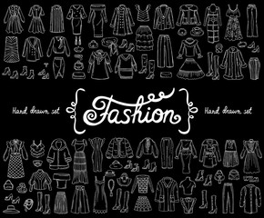 Vector set with hand drawn isolated doodles on the theme of fashion on black color