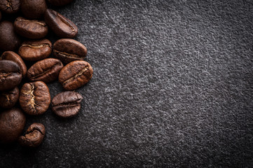 roasted coffee beans on dark background, can be used as a background