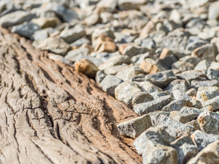 Closeup of cracked wooden and gravel background