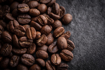 roasted coffee beans on dark background, can be used as a background