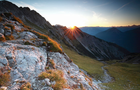 sunrise over rock in Alps
