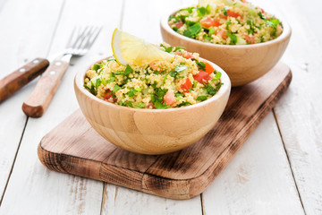 Tabbouleh salad with couscous on a white table

