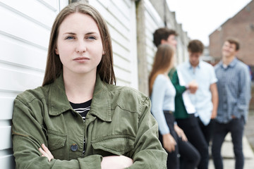 Gang Of Teenagers Hanging Out In Urban Environment