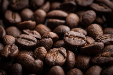 roasted coffee beans on dark background, can be used as a background