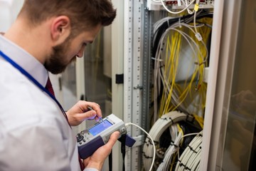 Technician using digital cable analyzer