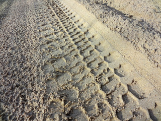 SUV wheel trace on the desert road after the rain in the Western Kazakhstan